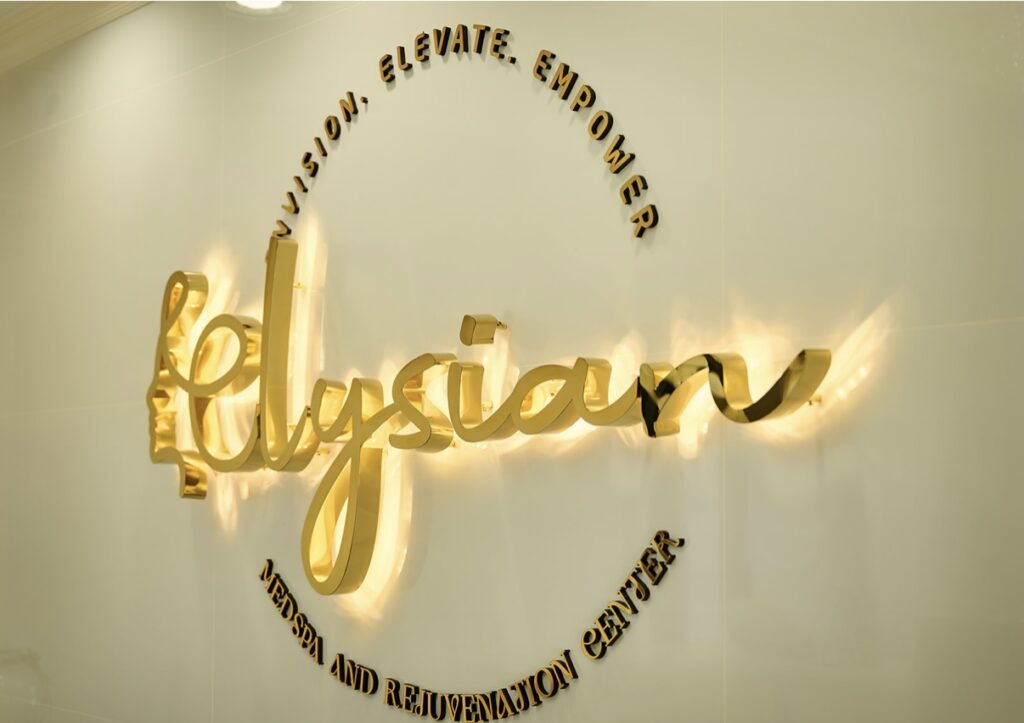 Logo of Elysian Medspa & Rejuvenation Center on Wall Inside of Clinic