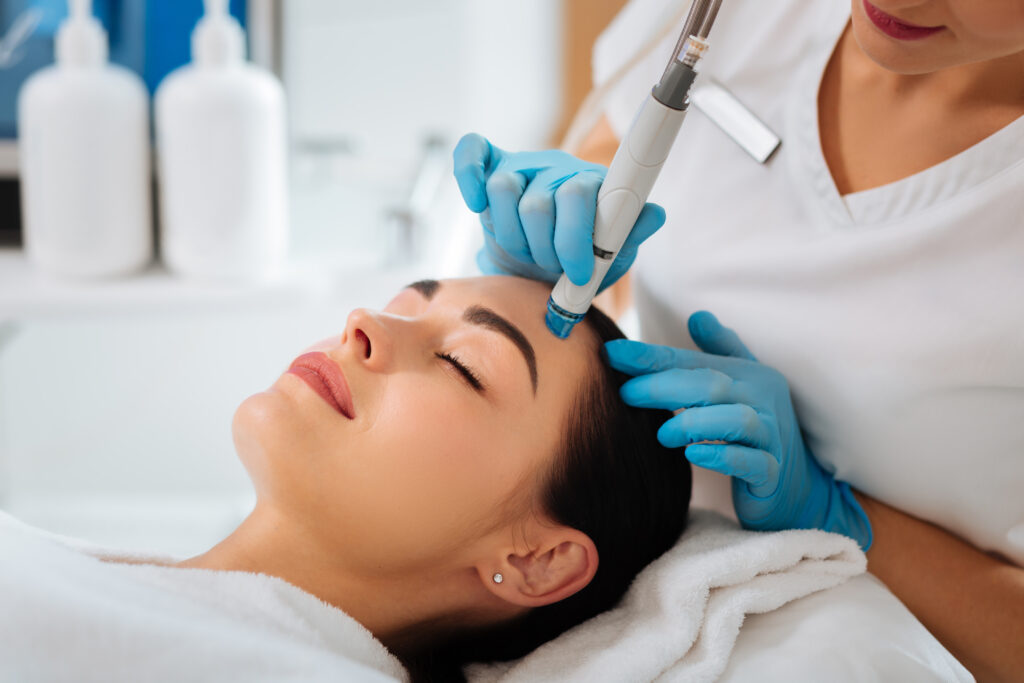 Patient receiving hydrafacial treatment at Elysian Medspa & Rejuvenation Center