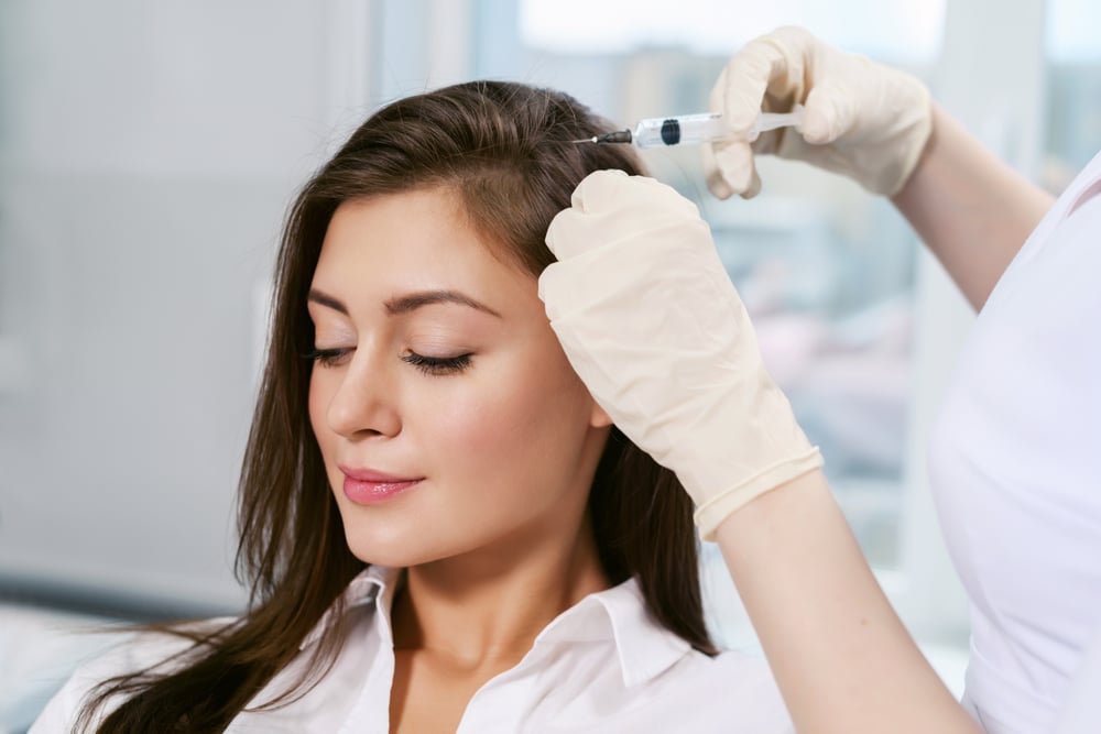 Patient getting PRP treatment for hair growth at Elysian Medspa & Rejuvenation Center