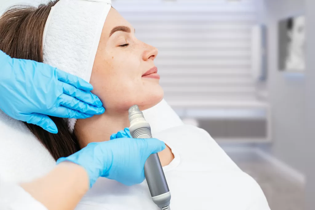 Patient getting hydrofacial treatment on lower part of face at Elysian Medspa & Rejuvenation Center
