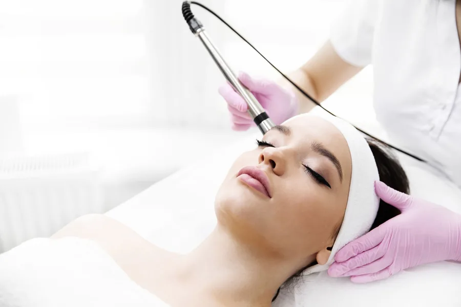 Woman receiving PICO laser treatment on her face